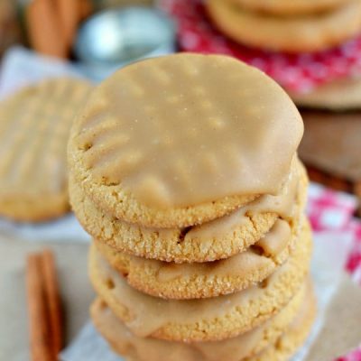 stack of peanut butter cookies with maple glaze and title overlay at top of image