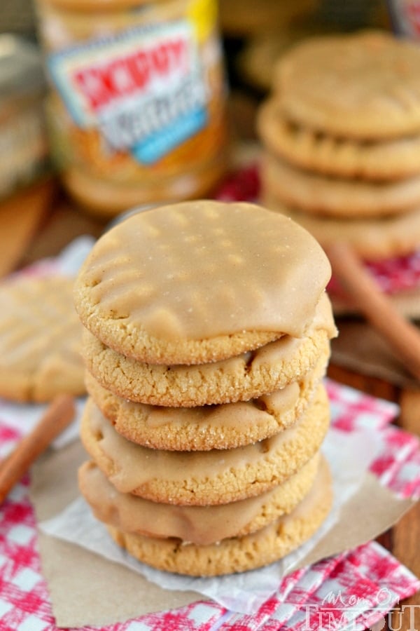 peanut butter cookies stacked on parchment paper