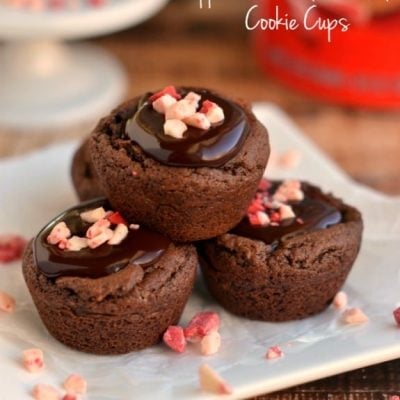 chocolate cookie cups on white plate topped with peppermint