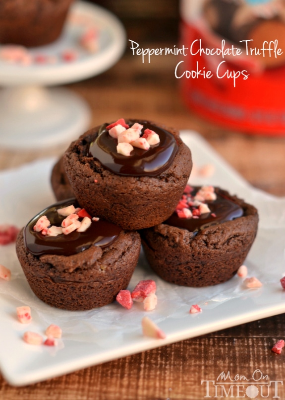 chocolate cookie cups on white plate topped with peppermint