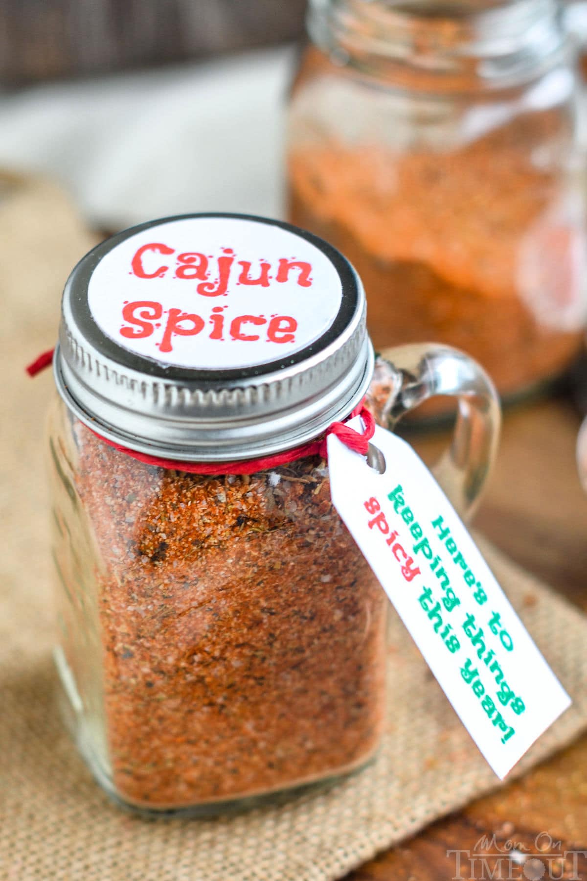 cajun seasoning in a small spice bottle with a tag and label ready for gifting.