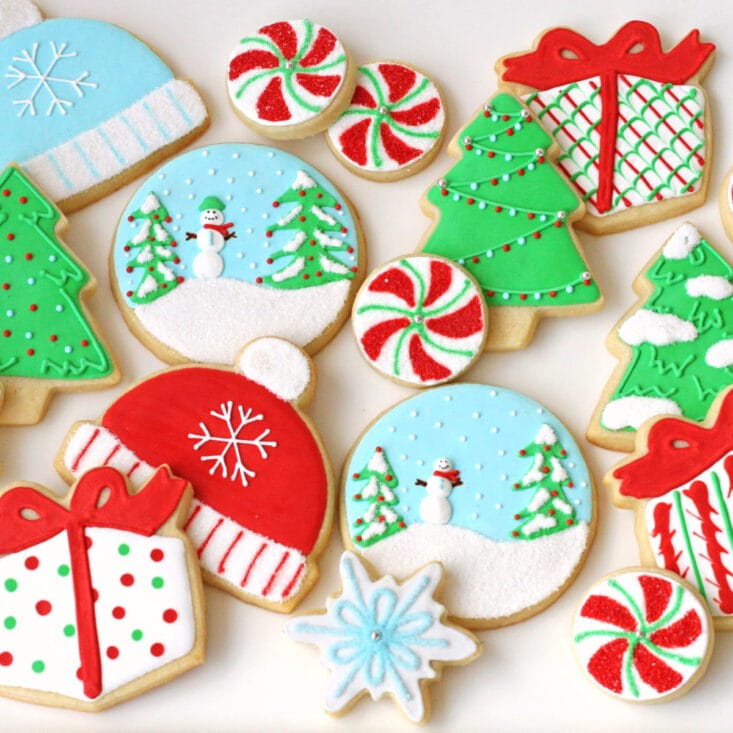 top down view of decorated sugar cookies on white surface