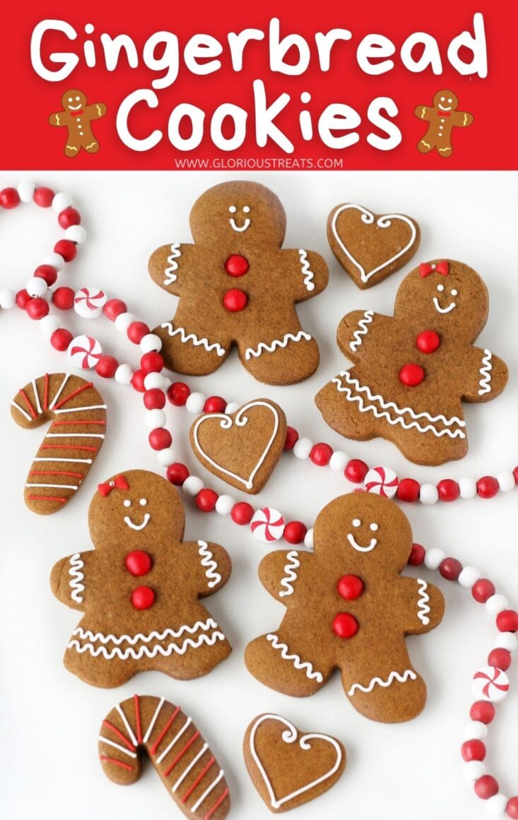 gingerbread cookies decorated simply laid out on white surface with title overlay at top glorious treats 