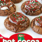 hot cocoa cookies on white plate with christmas sprinkles on top and title overlay at bottom