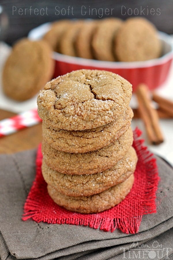 ginger molasses cookies in a stack on red burlap sitting on brown napking