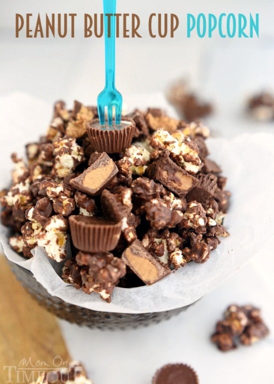 You're going to love this Peanut Butter Cup Popcorn with an explosion of peanut butter and chocolate flavors in every bite! | MomOnTimeout.com | #recipe #popcorn #chocolate #peanut #butter
