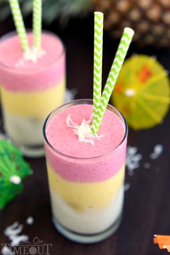 Make any morning better with this gorgeous, layered Tropical Sunrise Smoothie! | MomOnTimeout.com | #breakfast #smoothie #recipe