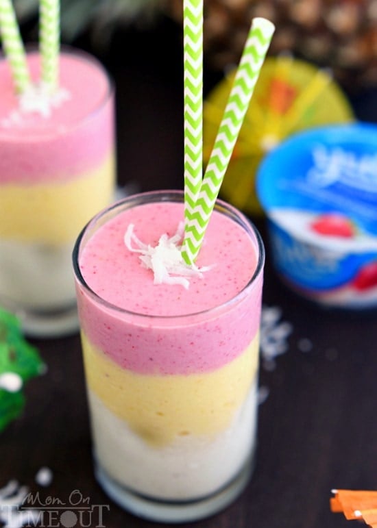 Make mornings better with this gorgeous, layered Tropical Sunrise Smoothie! Made with coconut milk and yogurt for a nutritious, healthy start to your day. | MomOnTimeout.com | #recipe #breakfast #smoothie