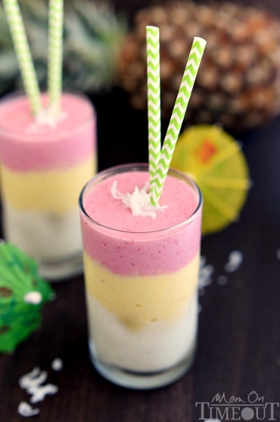 Make any morning better with this gorgeous, layered Tropical Sunrise Smoothie! | MomOnTimeout.com | #breakfast #smoothie #recipe