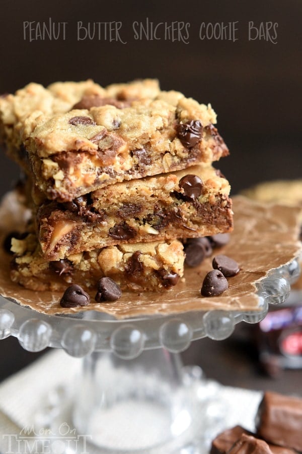 Peanut Butter Snickers Cookie Bars - all things good in this world. These bars are delightfully chewy, incredibly moist, and just oozing with chocolate and peanut butter flavor. | MomOnTimeout.om