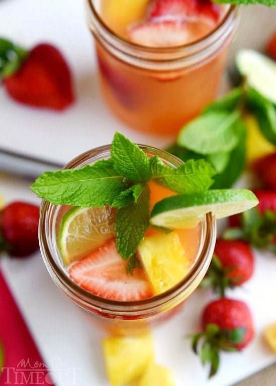 Perfectly cool, sweet, and SO refreshing, this fruit-infused Pineapple Strawberry Mojito cocktail has it all! | MomOnTimeout.com