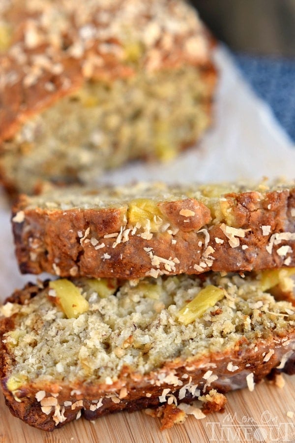 This easy Pina Colada Banana Bread recipe is our new favorite! Super moist and delicious banana bread topped with a pineapple-rum glaze and toasted coconut! | MomOnTimeout.com