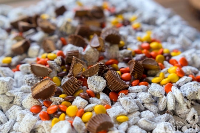 Reese's Muddy Buddies are taken to the next level in this amazingly delicious and easy dessert recipe! Reese's all the things! Reese's Pieces, Reese's Peanut Butter Chips, Reese's Minis, and Reese's Miniatures are all perfectly happy sharing space in this powdered sugar coated wonder land known as Muddy Buddies. | MomOnTimeout.com