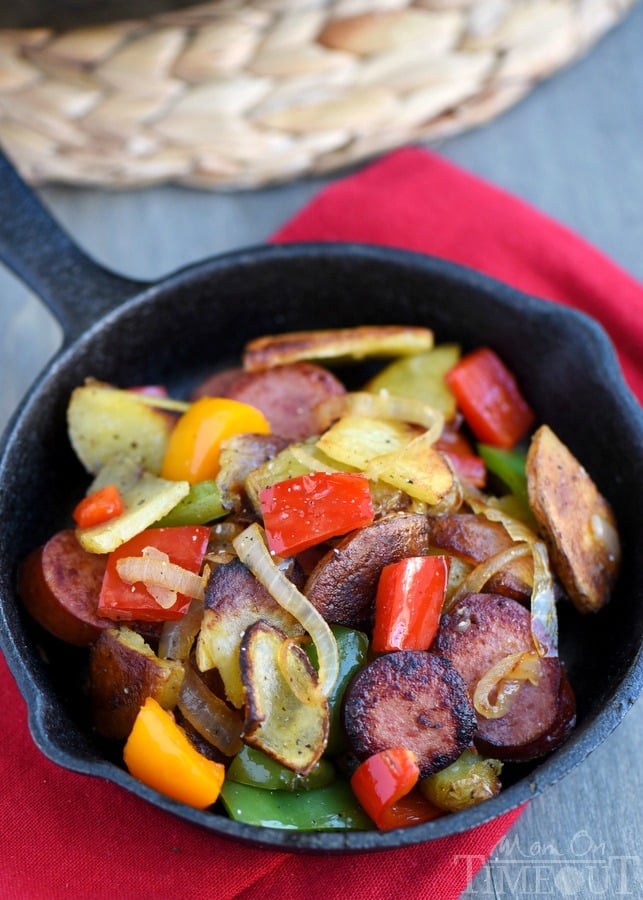 This Kielbasa, Peppers, and Potato Hash is a delicious and easy dinner recipe that takes just 20 minutes and one skillet! Full of fresh veggies and turkey kielbasa makes this dinner both nutritious and filling! | MomOnTImeout.com