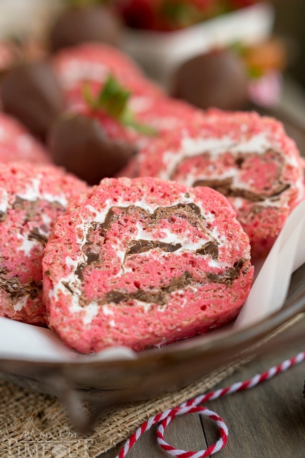 Chocolate Covered Strawberry Rice Krispies Treats Pinwheels are the perfect treat for your next party or picnic! Pretty and pink and so yummy to eat, this easy dessert is guaranteed to become a new family favorite! | MomOnTimeout.com