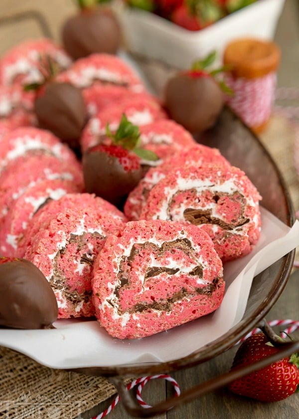 Chocolate Covered Strawberry Rice Krispies Treats Pinwheels are the perfect treat for your next party or picnic! Pretty and pink and so yummy to eat, this easy dessert is guaranteed to become a new family favorite! | MomOnTimeout.com