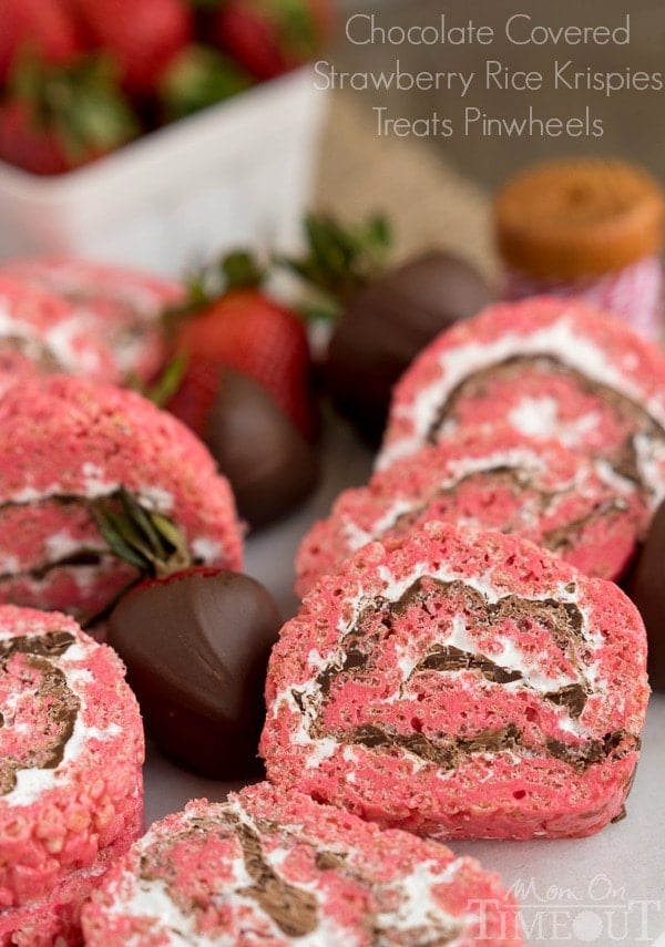 Chocolate Covered Strawberry Rice Krispies Treats Pinwheels are the perfect treat for your next party or picnic! Pretty and pink and so yummy to eat, this easy dessert is guaranteed to become a new family favorite! | MomOnTimeout.com