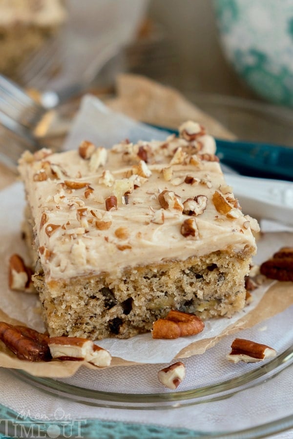easy banana cake recipe with nuts and cream cheese frosting on plate