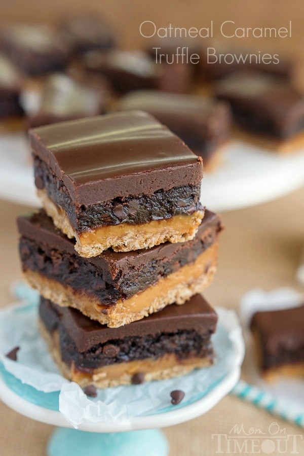 Four layers of intense flavor will have you craving these Oatmeal Caramel Truffle Brownies day and night! An oatmeal cookie crust topped with rich caramel, fudgy brownie and ganache frosting. Welcome to paradise. | MomOnTimeout.com | #IDelightIn10 #recipe 