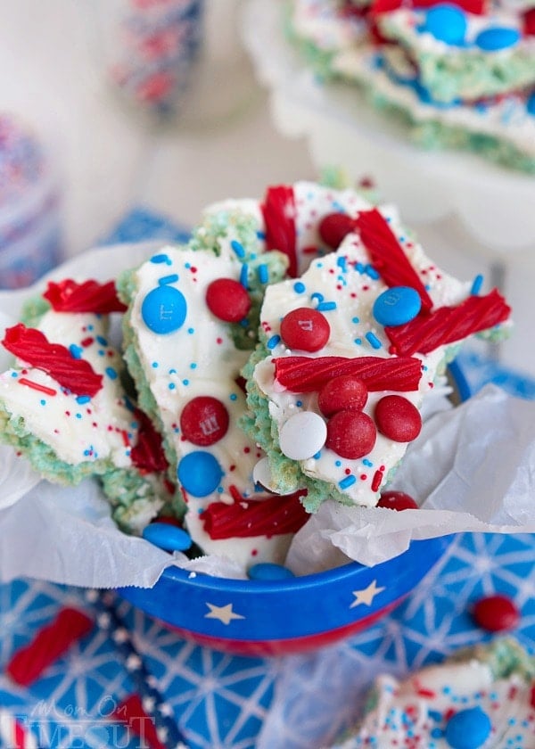 These sweet treats are sure to satisfy everyone! Colorful and festive, this Red White and Blue Rice Krispies Treats Bark is the perfect no-bake treat to celebrate with! | MomOnTimeout.com | #4thofjuly #laborday #memorialday