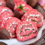 Metal tray filled with strawberry and chocolate rice krispie treat pinwheels along with chocolate covered strawberries.