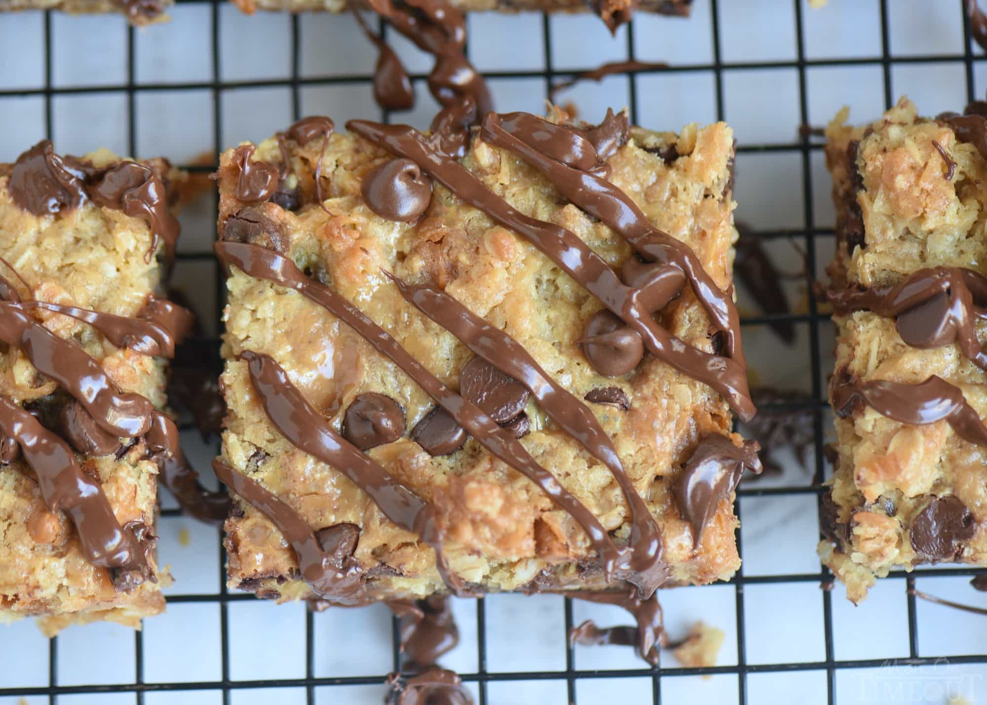 These Coconut Butterscotch Chocolate Chip Gooey Bars are sure to be a hit! So much flavor in one bite! Perfect for potlucks, picnics, road trips and more! // Mom On Timeout