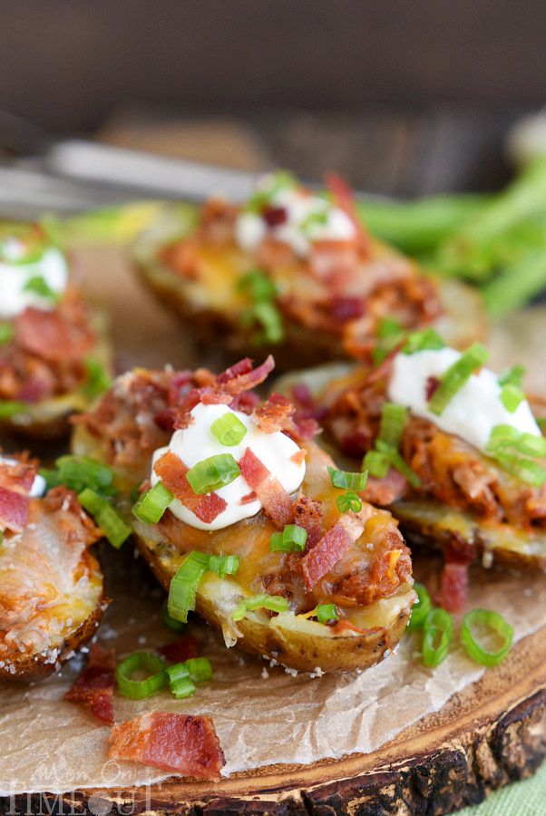 Too hot to cook indoors? Make these Fully Loaded Grilled BBQ Pork Potato Skins tonight! Fun enough for an appetizer yet hearty enough for a main dish, this delicious recipe is cooked straight on the grill and is perfect for all of your summer time entertaining! | MomOnTimeout.com | #recipe #appetizer #game #ad