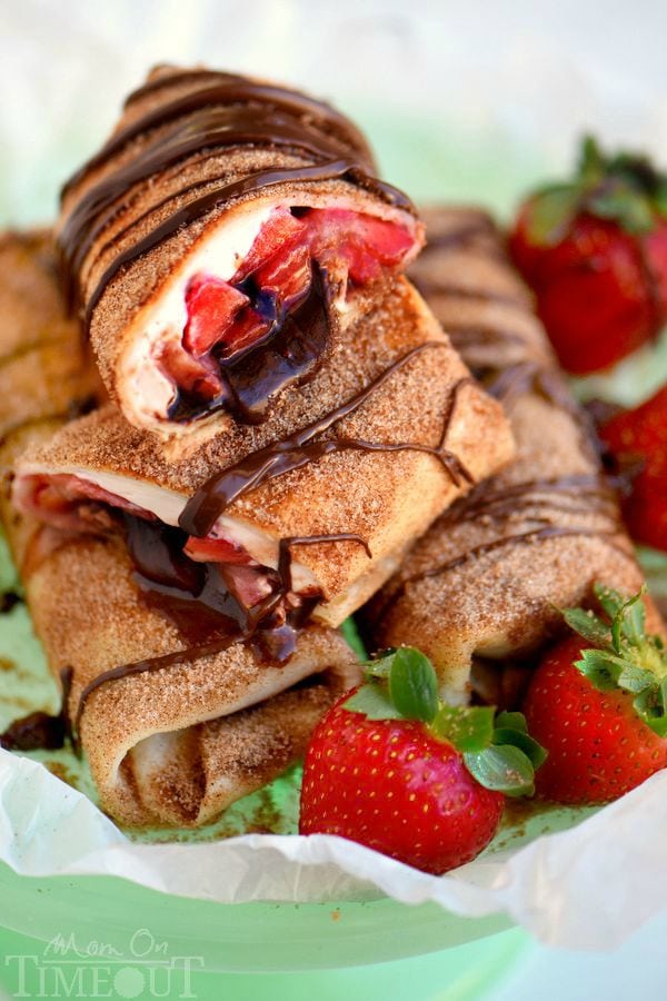 These Chocolate Strawberry Cheesecake Chimichangas are so easy to make and are perfect for a crowd OR an easy weeknight dessert. Fresh strawberries, strawberry cream cheese and chocolate are wrapped in a tortilla, fried to a golden brown and rolled in cinnamon and sugar - totally irresistible!