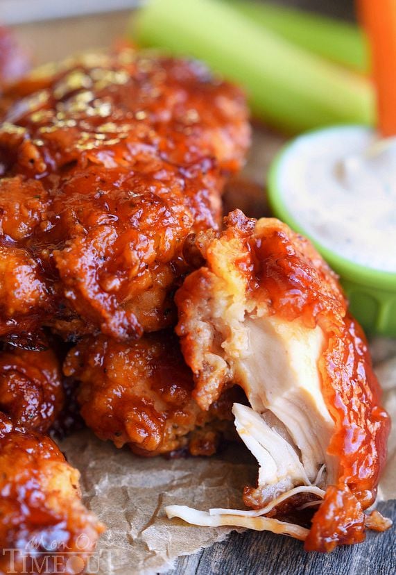  Sticky sweet Honey BBQ Chicken Strips are perfect for dinner or game day! Marinated in buttermilk and perfectly seasoned, these strips are hard to resist! | MomOnTimeout.com