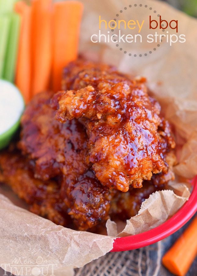  Sticky sweet Honey BBQ Chicken Strips are perfect for dinner or game day! Marinated in buttermilk and perfectly seasoned, these strips are hard to resist! | MomOnTimeout.com