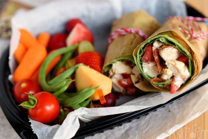 This BLT Chicken Caesar Salad Wrap has all the makings to become your new go-to recipe! Chicken, bacon, Caesar dressing, and tomato are wrapped up in an easy-to-make meal that is perfect for a light dinner or lunch. | MomOnTimeout.com | #recipe #ad