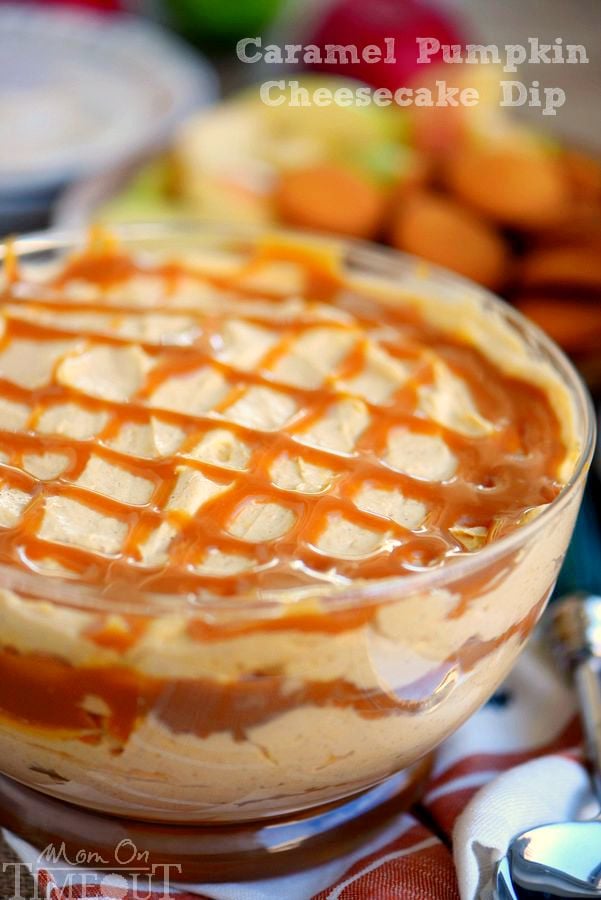 Caramel Pumpkin Cheesecake Dip in a clear bowl drizzled with caramel on top