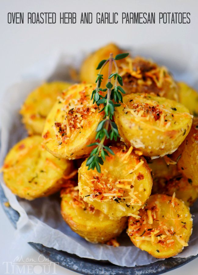 These Oven Roasted Herb and Garlic Parmesan Potatoes are the perfect side dish to whatever you're making for dinner tonight! Perfectly crispy on the outside and light and fluffy on the inside!