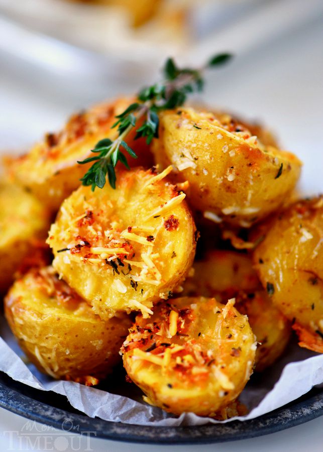 These Oven Roasted Herb and Garlic Parmesan Potatoes are the perfect side dish to whatever you're making for dinner tonight! Perfectly crispy on the outside and light and fluffy on the inside!