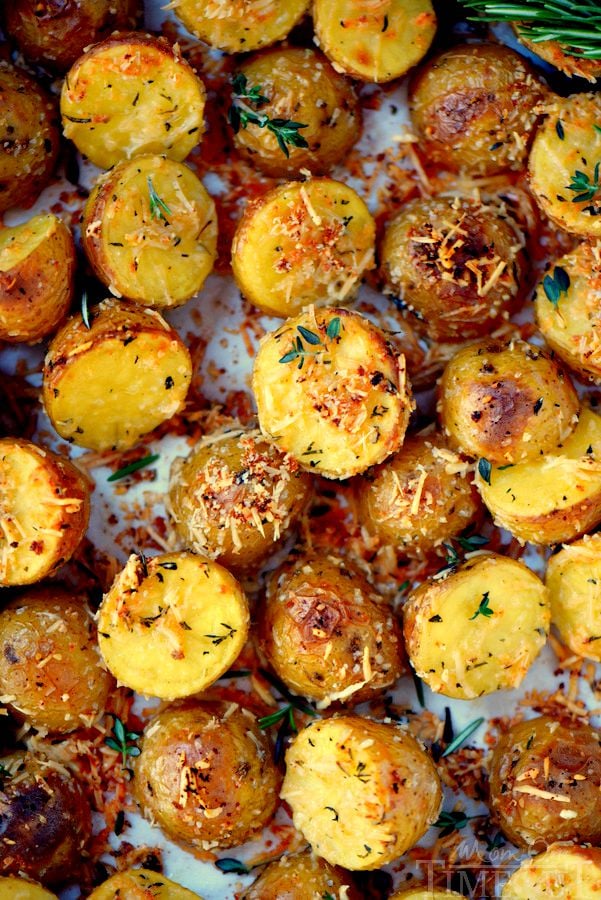 These Oven Roasted Herb and Garlic Parmesan Potatoes are the perfect side dish to whatever you're making for dinner tonight! Perfectly crispy on the outside and light and fluffy on the inside!