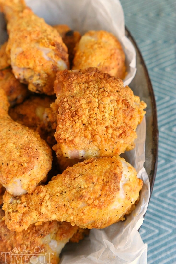 best oven fried chicken piled high on a plate