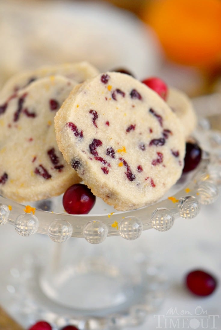 Cranberry Orange Shortbread Cookies combine two of my favorite holiday flavors in one easy to make cookie that will wow friends and family! A delightfully easy cookie recipe that yields sensational results! I'm sharing three secrets to the perfect shortbread cookies that no one can resist! Make sure to add these easy shortbread cookies to your holiday baking list this season! // Mom On Timeout #cookies #shortbread# cranberry #orange #Christmas #baking #holidays #Thanksgiving cranberry-orange-shortbread-cookies-recipe