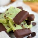 mint shortbread cookies dipped in chocolate and arranged on a white plate