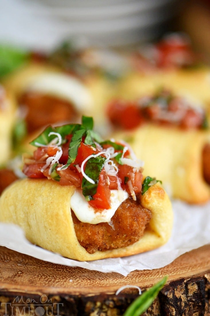 These Parmesan Shrimp Bruschetta Bites are a delightfully easy appetizer that everyone will enjoy! Made with fresh mozzarella, crescent rolls and finished with a bruschetta topping. Great for holiday parties, football, and more!