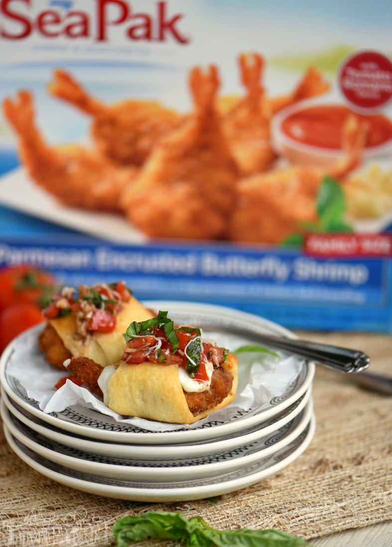 These Parmesan Shrimp Bruschetta Bites are a delightfully easy appetizer that everyone will enjoy! Made with fresh mozzarella, crescent rolls and finished with a bruschetta topping. Great for holiday parties, football, and more!