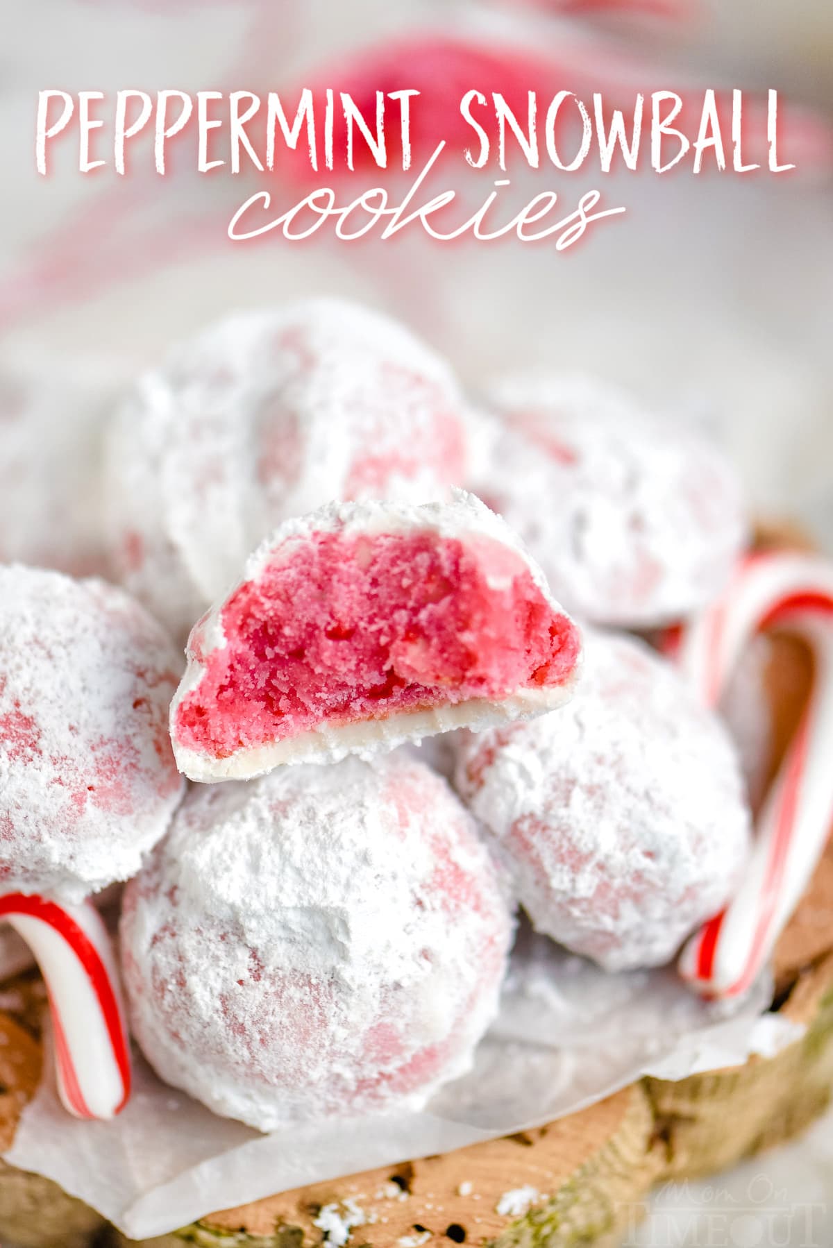 peppermint snowball cookies in a pile with one cookie broken in half showing the pink interior with title overlay at top of image