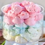 Glass trifle jar filled with pastel colored jello divinity layered by color.