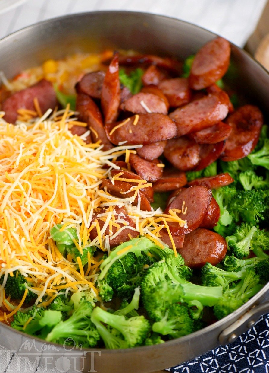 Cheesy Kielbasa, Rice and Broccoli Skillet - your new favorite dinner! This easy skillet recipe comes together in a flash and is made in a single skillet for easy clean-up. Extra cheesy, and just bursting with flavor, it's a dinner recipe you'll find yourself making again and again.