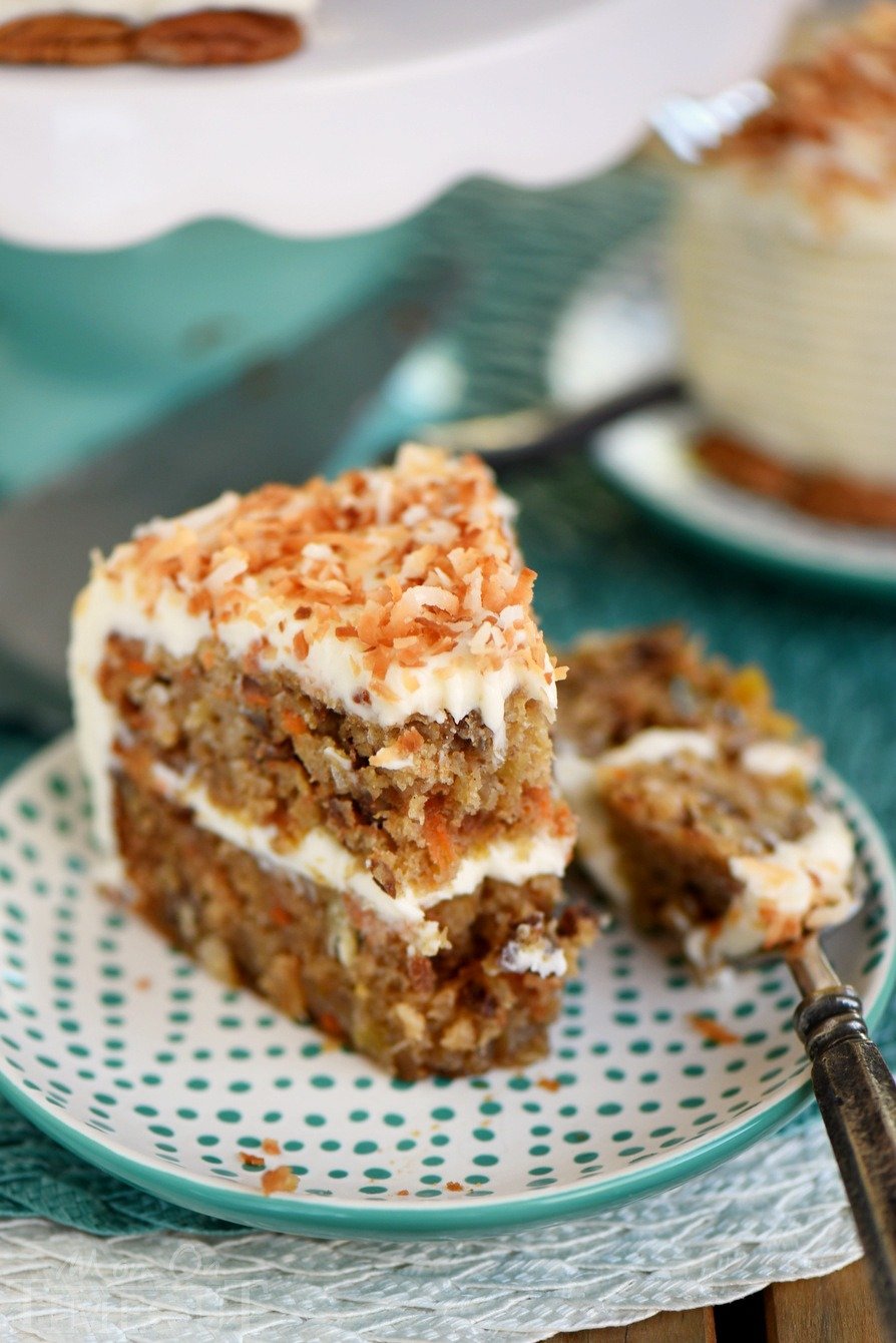 This Slow Cooker Carrot Cake with Cream Cheese Frosting is going to change your life! Free up the oven and get the moistest carrot cake you've ever had - right from your slow cooker! Made without oil or butter and loaded with coconut, pineapple and pecans!