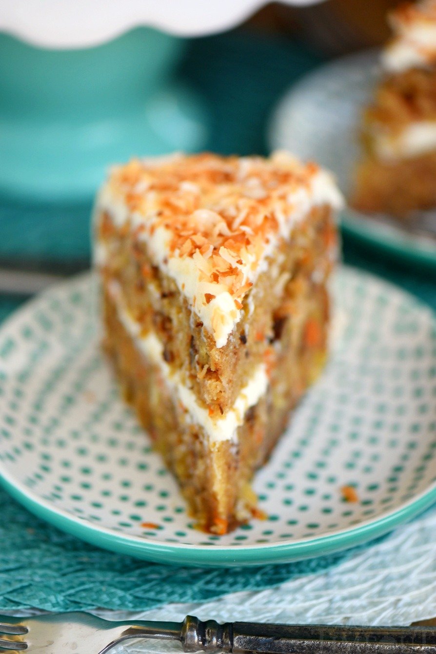 This Slow Cooker Carrot Cake with Cream Cheese Frosting is going to change your life! Free up the oven and get the moistest carrot cake you've ever had - right from your slow cooker! Made without oil or butter and loaded with coconut, pineapple and pecans!