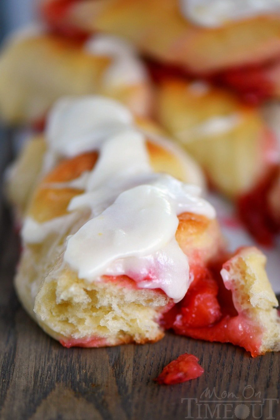 Strawberry Twists with Lemon Cream Cheese Glaze are sure to become your new favorite addition to Sunday brunch! A homemade strawberry filling makes these twists extra special and delicious and the lemon cream cheese glaze is going to knock your socks off! | Mom On Timeout