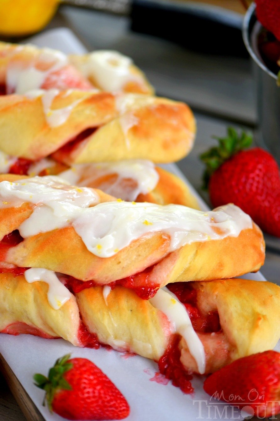 Strawberry Twists with Lemon Cream Cheese Glaze are sure to become your new favorite addition to Sunday brunch! A homemade strawberry filling makes these twists extra special and delicious and the lemon cream cheese glaze is going to knock your socks off! | Mom On Timeout