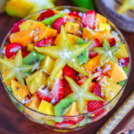 top down look at fruit salad with a star fruit right on top.