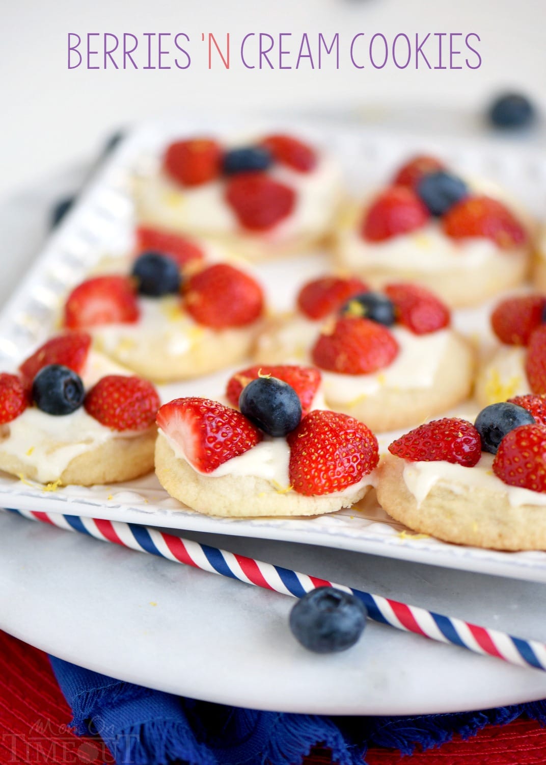 Almost too pretty to eat, these Berries 'N Cream Cookies are the easiest recipe you'll make all summer long! Sweet sugar cookies are topped with a bright, lemon cream cheese frosting and fresh berries! Soooo good!