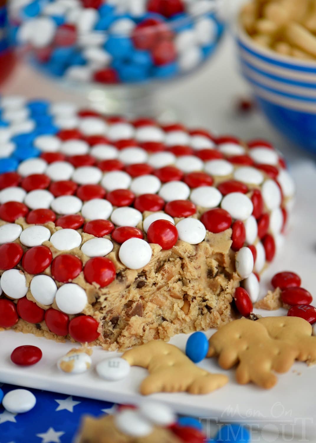 Celebrate with this outrageous Chocolate Chip Cookie Dough Flag Dip this 4th of July weekend! Edible chocolate chip cookie dough is loaded with toffee bits and peanut butter chips for the most delicious dip ever! Decorated in red, white, and blue, this easy dessert recipe is perfect for Memorial Day and Labor Day weekend as well!